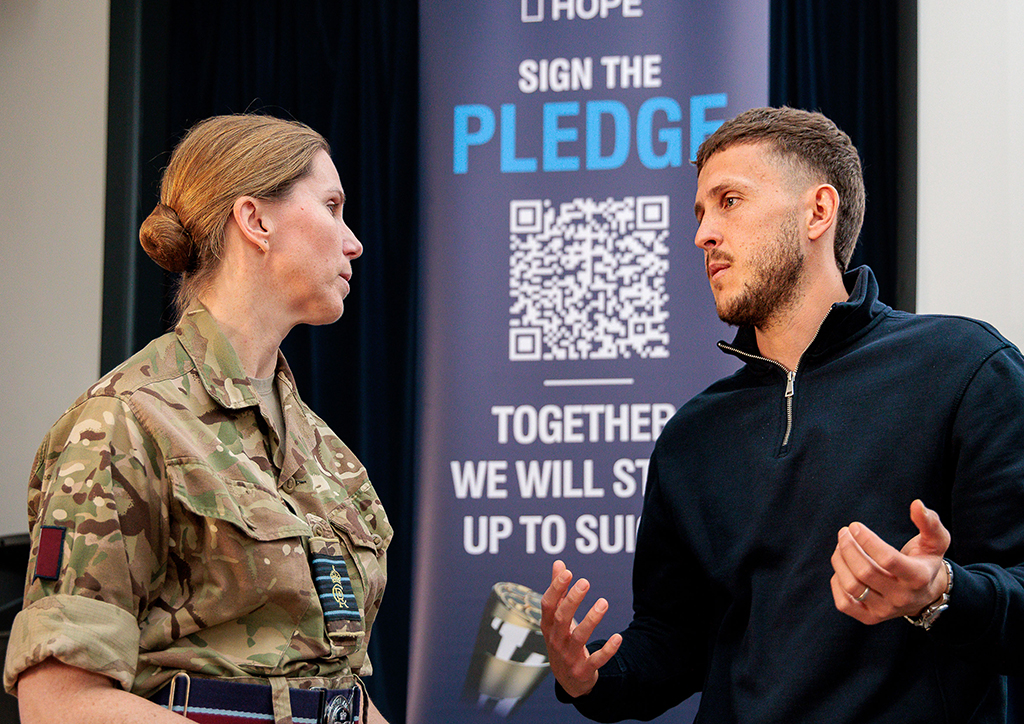 A speaker talks with The Station Commander of RAF Brize Norton.